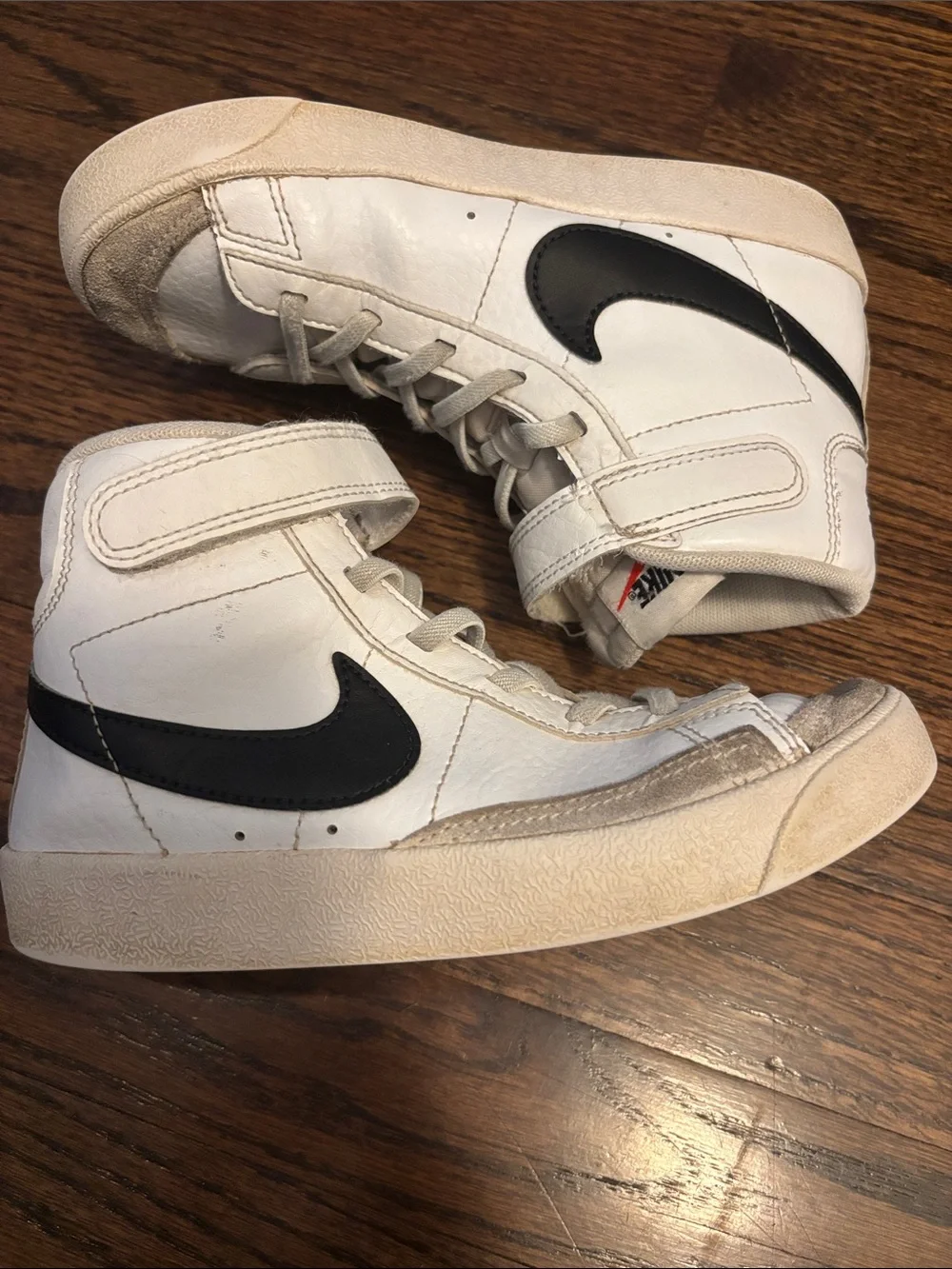 Nike Kids White and Black High-Top Sneakers with Orange Swoosh